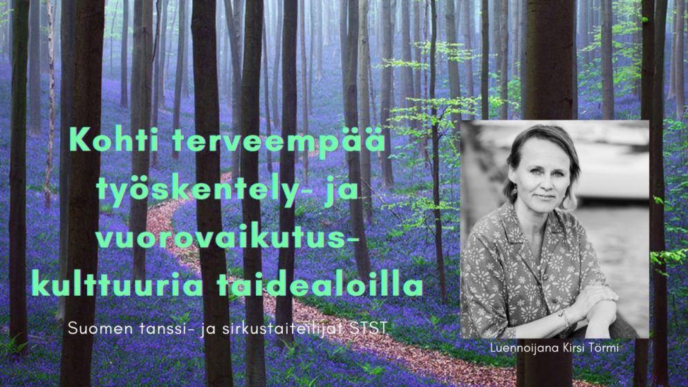 Kasvokuva Kirsistä. Taustana on sinisten kukkien peittämä metsänpohja.